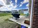 Patio and grill, lawn and view of back of other houses at 6040 Bluecrest Dr, Brownsburg, IN 46234