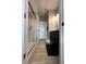 Modern bathroom featuring a glass-enclosed shower and dark vanity with dual sinks at 6040 Bluecrest Dr, Brownsburg, IN 46234