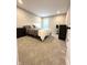 Spare bedroom with neutral walls, plush carpet and black furniture at 6040 Bluecrest Dr, Brownsburg, IN 46234