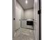 Well-lit laundry room with tiled floors and modern washer and dryer units for convenience at 6040 Bluecrest Dr, Brownsburg, IN 46234