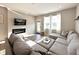 Inviting living room with a cozy fireplace and a comfortable sectional sofa at 6040 Bluecrest Dr, Brownsburg, IN 46234