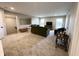 Spacious living room featuring an olive green couch set and neutral carpeting at 6040 Bluecrest Dr, Brownsburg, IN 46234