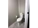 A clean toilet with a woven basket on top, situated in a well-maintained bathroom space at 6040 Bluecrest Dr, Brownsburg, IN 46234
