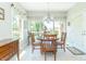 Sunny dining area featuring multiple windows and light tile floors at 6077 W David Wayne Dr, New Palestine, IN 46163