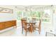 Bright dining area with multiple windows, chandelier, and built-in sideboard at 6077 W David Wayne Dr, New Palestine, IN 46163