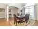 Dining room features a chandelier, large window with natural light and decorative rug at 6077 W David Wayne Dr, New Palestine, IN 46163