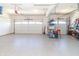 Spacious three car garage with sealed concrete flooring at 6077 W David Wayne Dr, New Palestine, IN 46163