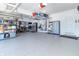 Well organized three car garage with storage racks and shelving at 6077 W David Wayne Dr, New Palestine, IN 46163