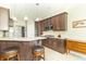 Kitchen with breakfast bar, stainless steel appliances, and granite countertops at 6077 W David Wayne Dr, New Palestine, IN 46163