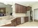 Modern kitchen with granite countertops, stainless steel appliances, and ample cabinet space at 6077 W David Wayne Dr, New Palestine, IN 46163