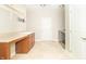Laundry room features a sink, countertop, and tile flooring at 6077 W David Wayne Dr, New Palestine, IN 46163