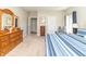 Spacious main bedroom with neutral tones, a large dresser, and plush carpeting at 6077 W David Wayne Dr, New Palestine, IN 46163