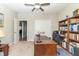 Office with a large desk, ceiling fan, bookcase, and ample storage space at 6077 W David Wayne Dr, New Palestine, IN 46163