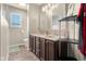 Bathroom with a double vanity, light-colored walls, and ceramic tile floor offering ample space and functionality at 6096 E Conestoga Trl, Columbus, IN 47203