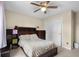 Traditional bedroom with a ceiling fan and closet at 6096 E Conestoga Trl, Columbus, IN 47203