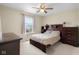 Comfortable bedroom with ceiling fan and natural light at 6096 E Conestoga Trl, Columbus, IN 47203