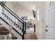 Entryway with staircase leading to the second floor and view into living room at 6096 E Conestoga Trl, Columbus, IN 47203