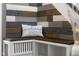 Close-up of entryway bench with 'Welcome Home' pillow and custom wall accent at 6096 E Conestoga Trl, Columbus, IN 47203