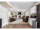 Relaxing living room with soft lighting, a large fireplace, and comfortable seating at 6096 E Conestoga Trl, Columbus, IN 47203