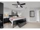 Bedroom featuring a cozy bed, modern lamps, and access to another room, creating a relaxed and connected space at 6096 E Conestoga Trl, Columbus, IN 47203