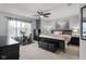 Spacious bedroom with natural light, a ceiling fan, and a full dresser, perfect for relaxation and storage at 6096 E Conestoga Trl, Columbus, IN 47203