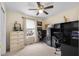 Home office features desk, window, and storage at 6096 E Conestoga Trl, Columbus, IN 47203
