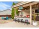 Inviting backyard with a covered bar area perfect for entertaining guests and enjoying summer days at 6096 E Conestoga Trl, Columbus, IN 47203