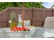 Outdoor dining table with fresh pineapple, watermelon, and refreshing beverages at 6096 E Conestoga Trl, Columbus, IN 47203
