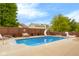A spacious backyard showcasing a stunning in-ground pool, slide, and ample lounging areas at 6096 E Conestoga Trl, Columbus, IN 47203