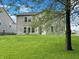 Spacious backyard with lush green grass, perfect for outdoor activities and relaxation at 625 Streamside Dr, Greenfield, IN 46140
