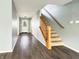 Inviting entryway with hardwood floors, a staircase, and natural light from the front door at 625 Streamside Dr, Greenfield, IN 46140