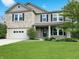 Charming two-story home with a well-manicured lawn and inviting curb appeal at 625 Streamside Dr, Greenfield, IN 46140