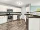 Modern kitchen featuring stainless steel appliances, stylish countertops, and ample cabinet space at 625 Streamside Dr, Greenfield, IN 46140