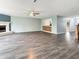Large living area with a fireplace, modern flooring, and seamless transitions to other rooms at 625 Streamside Dr, Greenfield, IN 46140