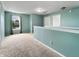 Spacious loft area featuring neutral carpet, large windows, and ample natural light at 625 Streamside Dr, Greenfield, IN 46140