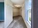 Walk-in closet with carpet flooring, wire shelving, and natural light, ready to be organized at 625 Streamside Dr, Greenfield, IN 46140