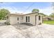 Brick house with a concrete patio and a fenced yard offers outdoor space at 645 W Stop 11 Rd, Indianapolis, IN 46217