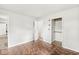 Bedroom showcasing wood-look floors, an open closet and doorway at 645 W Stop 11 Rd, Indianapolis, IN 46217