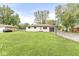 Charming single-story home with a well-maintained lawn and a basketball hoop, perfect for Gathering fun at 645 W Stop 11 Rd, Indianapolis, IN 46217