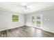 Bright game room showcasing wood grain flooring, a window and access to the outdoors at 645 W Stop 11 Rd, Indianapolis, IN 46217