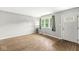 Living room features hardwood floors, lots of light and a front door with glass paneling at 645 W Stop 11 Rd, Indianapolis, IN 46217