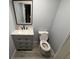 Bathroom features a modern vanity with drawers and a framed mirror at 7140 N Michigan Rd, Fairland, IN 46126
