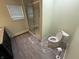 Bright, modern bathroom featuring gray vinyl floors and a glass enclosed shower at 7140 N Michigan Rd, Fairland, IN 46126