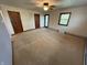 Bright bedroom featuring a ceiling fan and a door to the outside at 7140 N Michigan Rd, Fairland, IN 46126