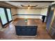 Bright dining area featuring hardwood floors, french doors, modern lighting, and a center island at 7140 N Michigan Rd, Fairland, IN 46126