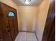 Welcoming entryway featuring tile floors, neutral walls, and a front door with decorative glass at 7140 N Michigan Rd, Fairland, IN 46126