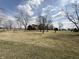 Expansive lawn leading up to a two-story home with a beautiful sky background at 7140 N Michigan Rd, Fairland, IN 46126