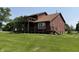 Two-story home with wood siding, featuring a deck and well-maintained landscaping at 7140 N Michigan Rd, Fairland, IN 46126