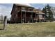 Two-story home with two wooden decks overlooking the backyard, offering a tranquil outdoor space at 7140 N Michigan Rd, Fairland, IN 46126