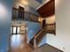Spacious foyer with wood stairs, a second-floor landing, and an open view into an adjacent living space at 7140 N Michigan Rd, Fairland, IN 46126
